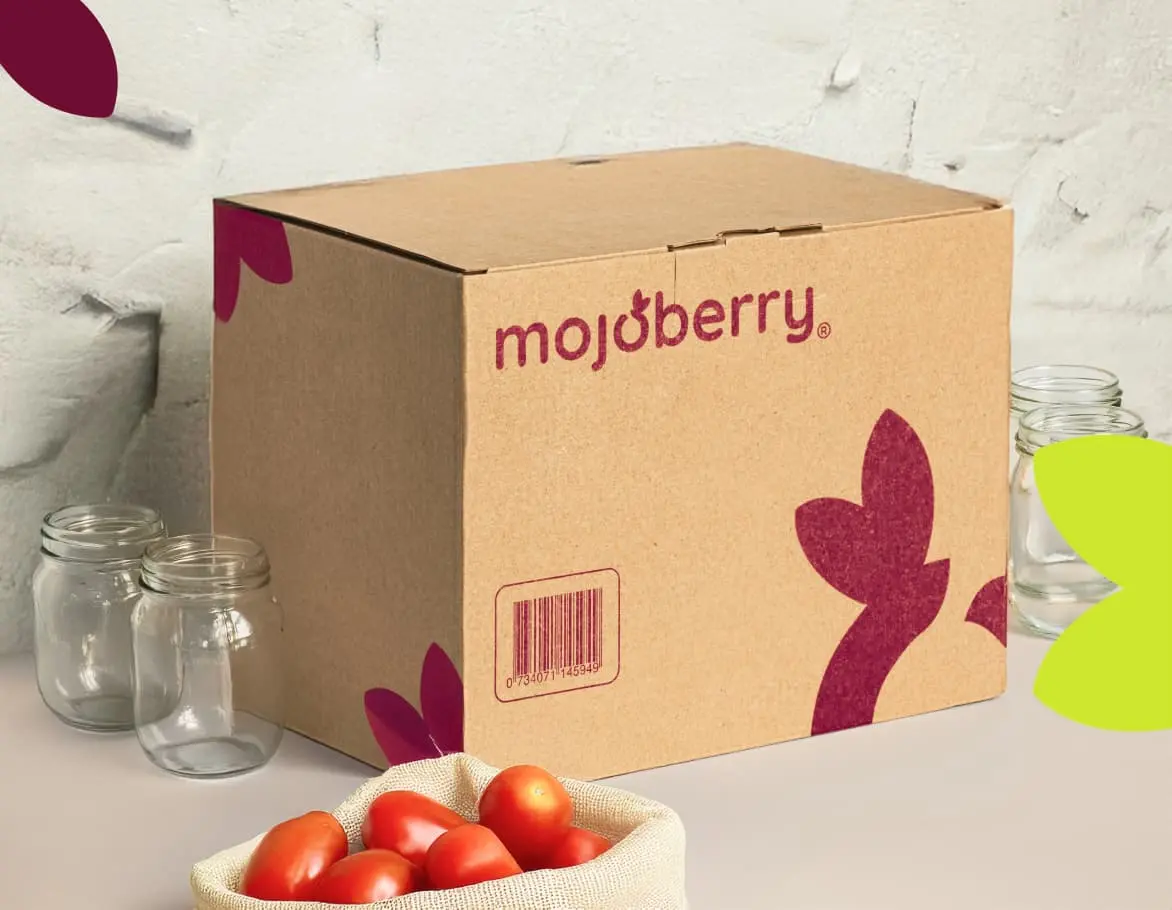 Branded shipping carton photographed with jars and tomatoes